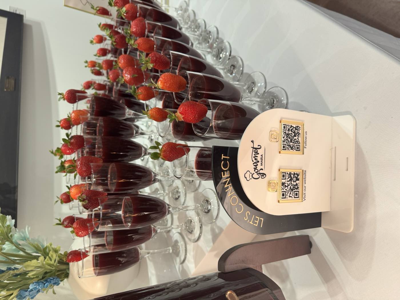 Sobolo hibiscus drink in champagne flutes garnished with strawberries by GourmetMaria